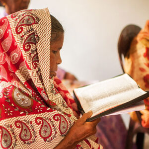 An Indian woman reading a Bible